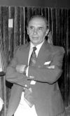 Black and white photo of a man wearing a suit